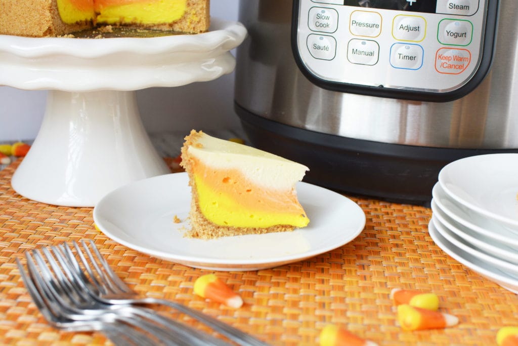 Candy Corn is a staple candy for Fall weather. Why not treat your taste buds to this creative Candy Corn Cheesecake made in the Instant Pot? Instant Pot Candy Corn Cheesecake, Candy Corn Cheesecake