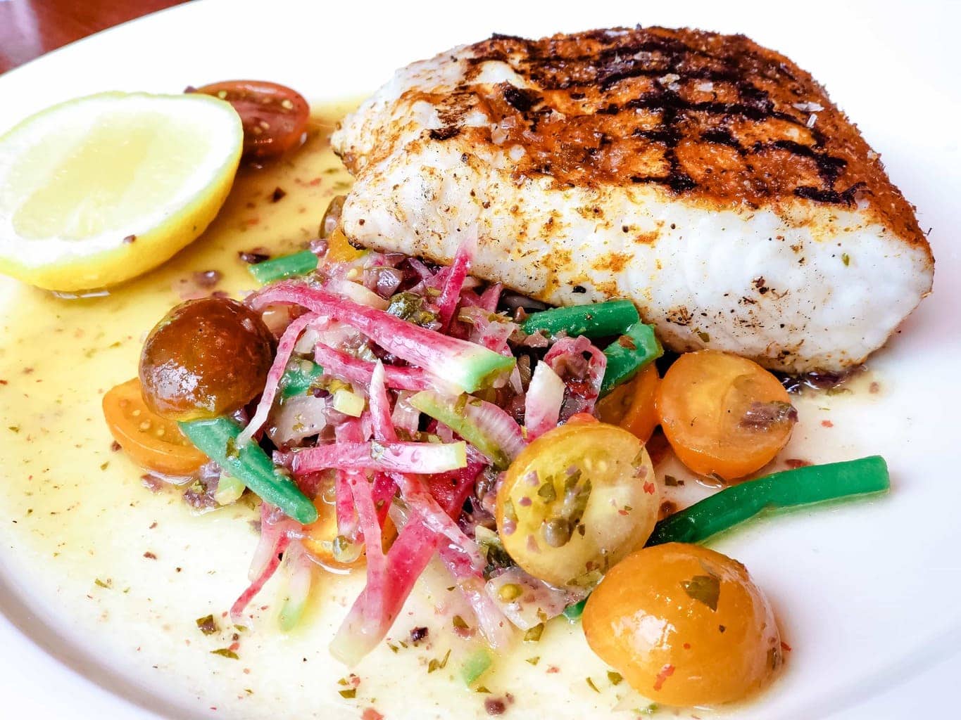 Mahi Mahi with Green Beans, Cherry Tomatoes, Lemon and Herbs - If you are in the Disney Springs area and love Italian food, Maria and Enzos Ristorante needs to be included in your dining plans. From the moment that you enter their doors, it's as though you've taken a trip directly to Italy. AD #MariaandEnzos #DisneySprings Maria & Enzos, Restaurants in Disney Springs, Disney Dining Plan Restaurants