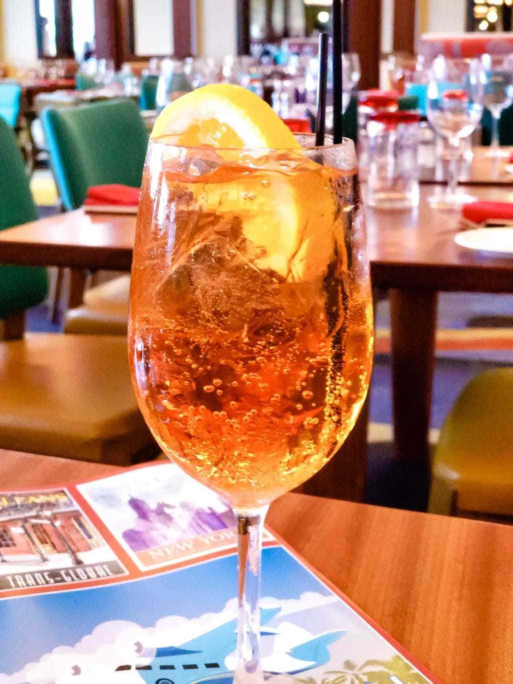 Aperol Spritz - Maria and Enzos; Enzos Ristorante, If you are in the Disney Springs area and love Italian food, Maria and Enzos Ristorante needs to be included in your dining plans. From the moment that you enter their doors, it's as though you've taken a trip directly to Italy. #MariaandEnzos #DisneySprings Aperol Spritz, Maria & Enzos Ristorante, Disney Springs