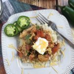 There are a ton of great Keto-friendly recipes out there that you and your taste buds will love, and they are healthier for you than other alternatives! This Keto Chicken Enchilada Bowl is one of those recipes. It packs a TON of amazing flavor, without the heavy carbs. #KetoEnchiladas #ChickenEnchiladaBowl #KetoRecipe #CauliflowerRice