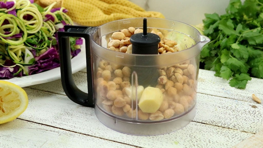 To make the peanut sauce, add ingredients to a food processor and purée until blended. Add coconut milk if needed to thin to desired consistency.